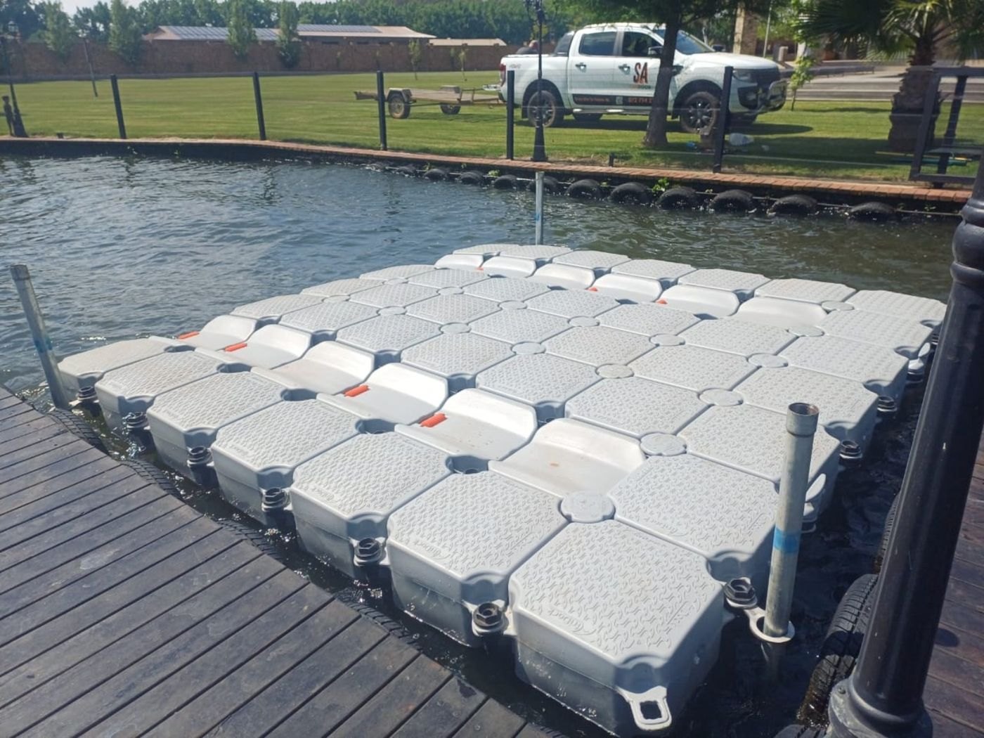 Angled view of completed double jet ski slide beside the existing jetty