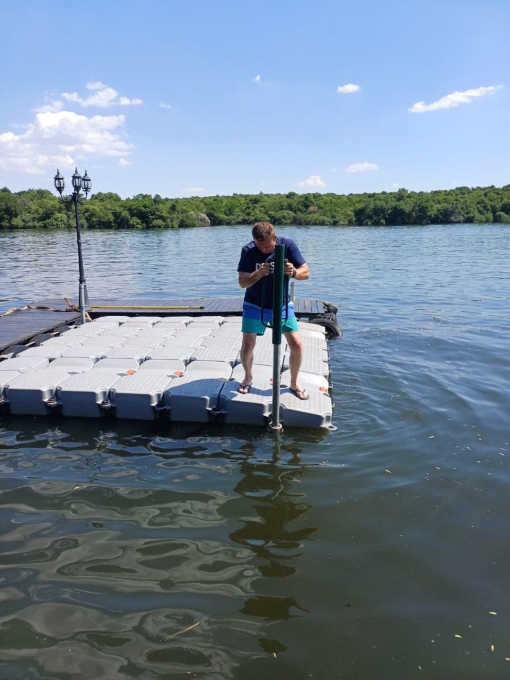 Installing galvanised anchoring poles for the double jet ski slide