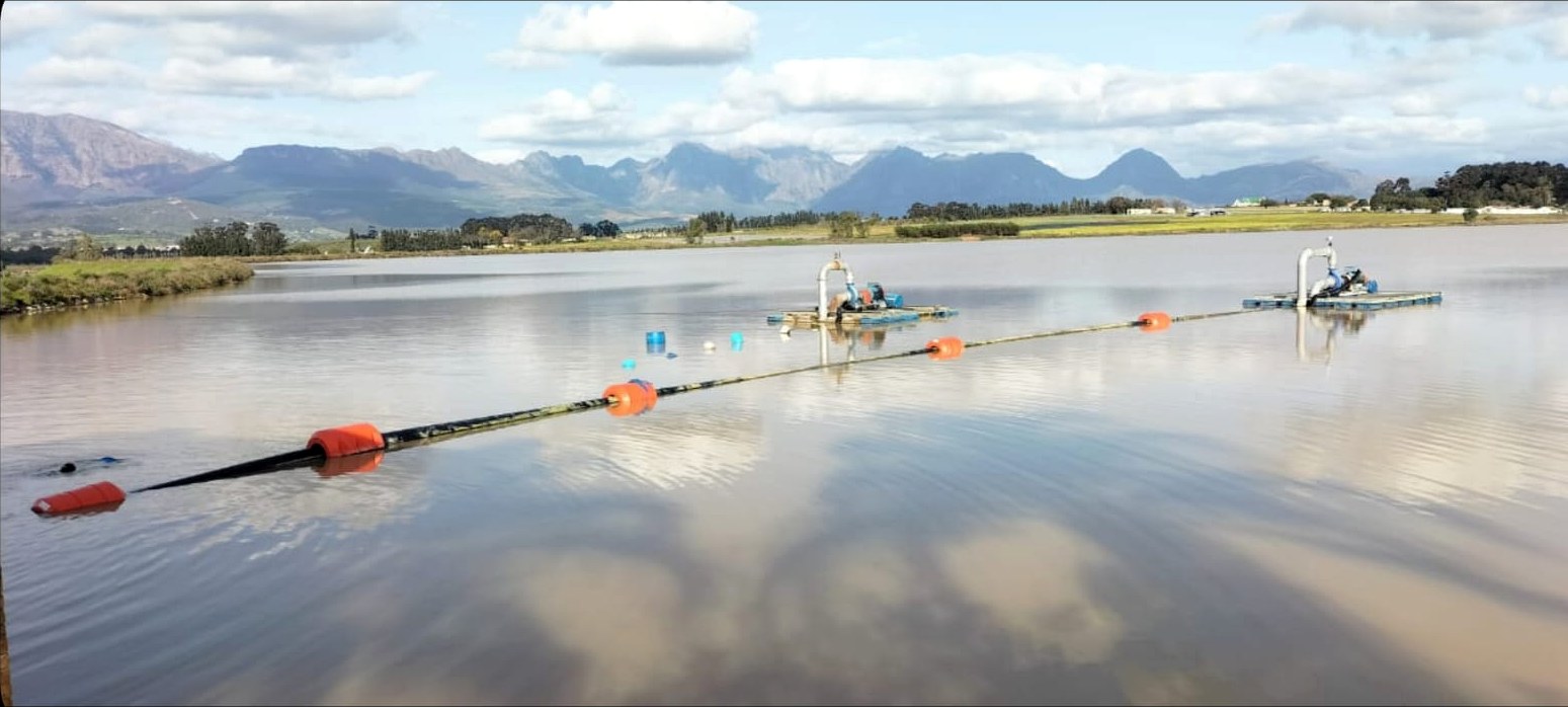 LDPE pipe floats in use with mountain backdrop