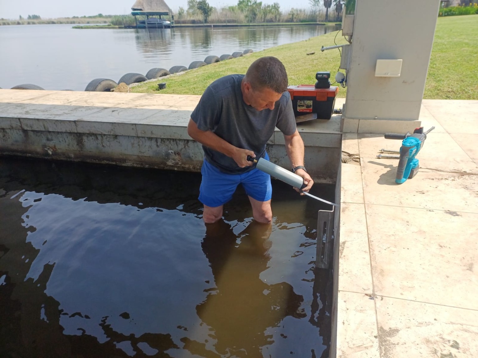 SA Outdoor team working on a boat slide installation on the Vaal River